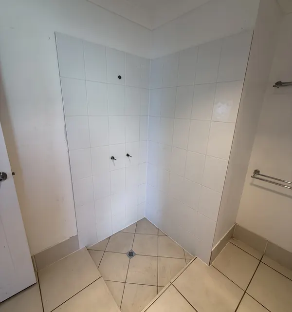Renovated bathroom with a retiled shower